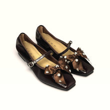 Load image into Gallery viewer, Jernn International brown Mary Jane flats with embellished satin bows and sparkling crystal accents.